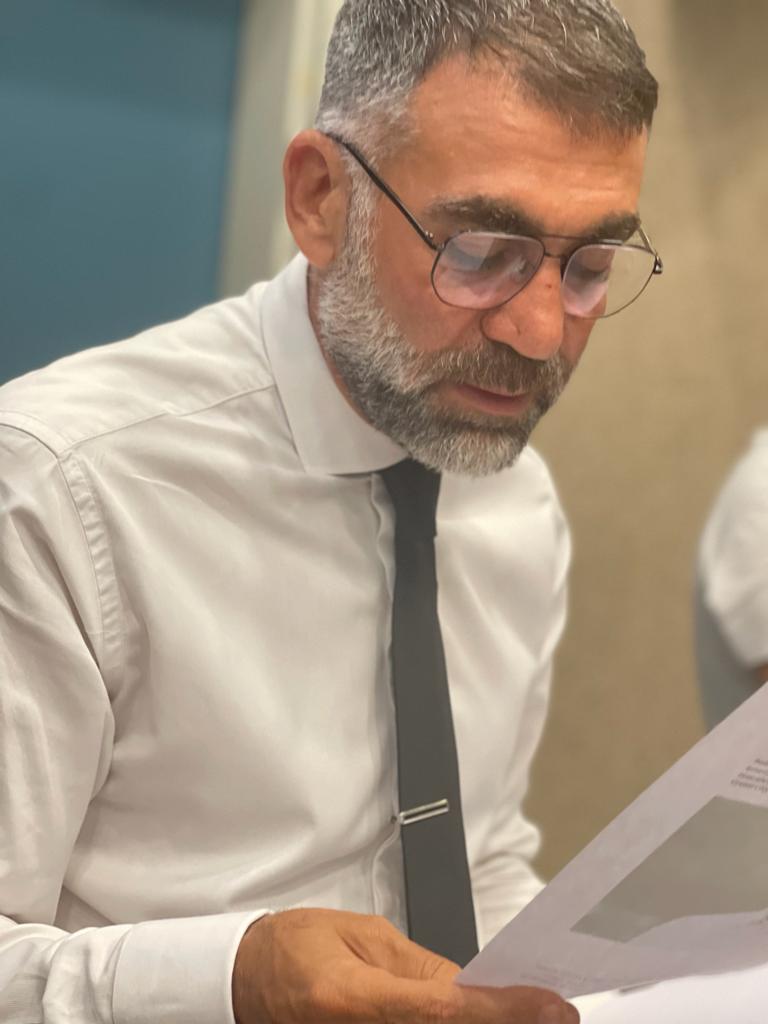 George Obeid reading a document